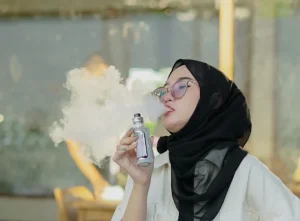 Woman In Glasses Vaping Direct To Lung